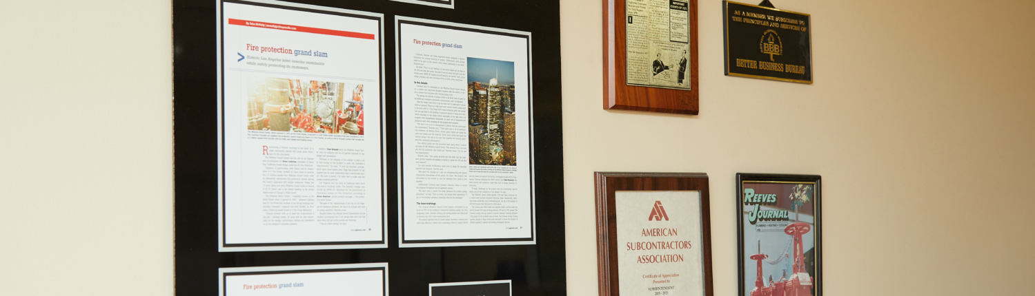 wall of awards and articles given to XL fire protection